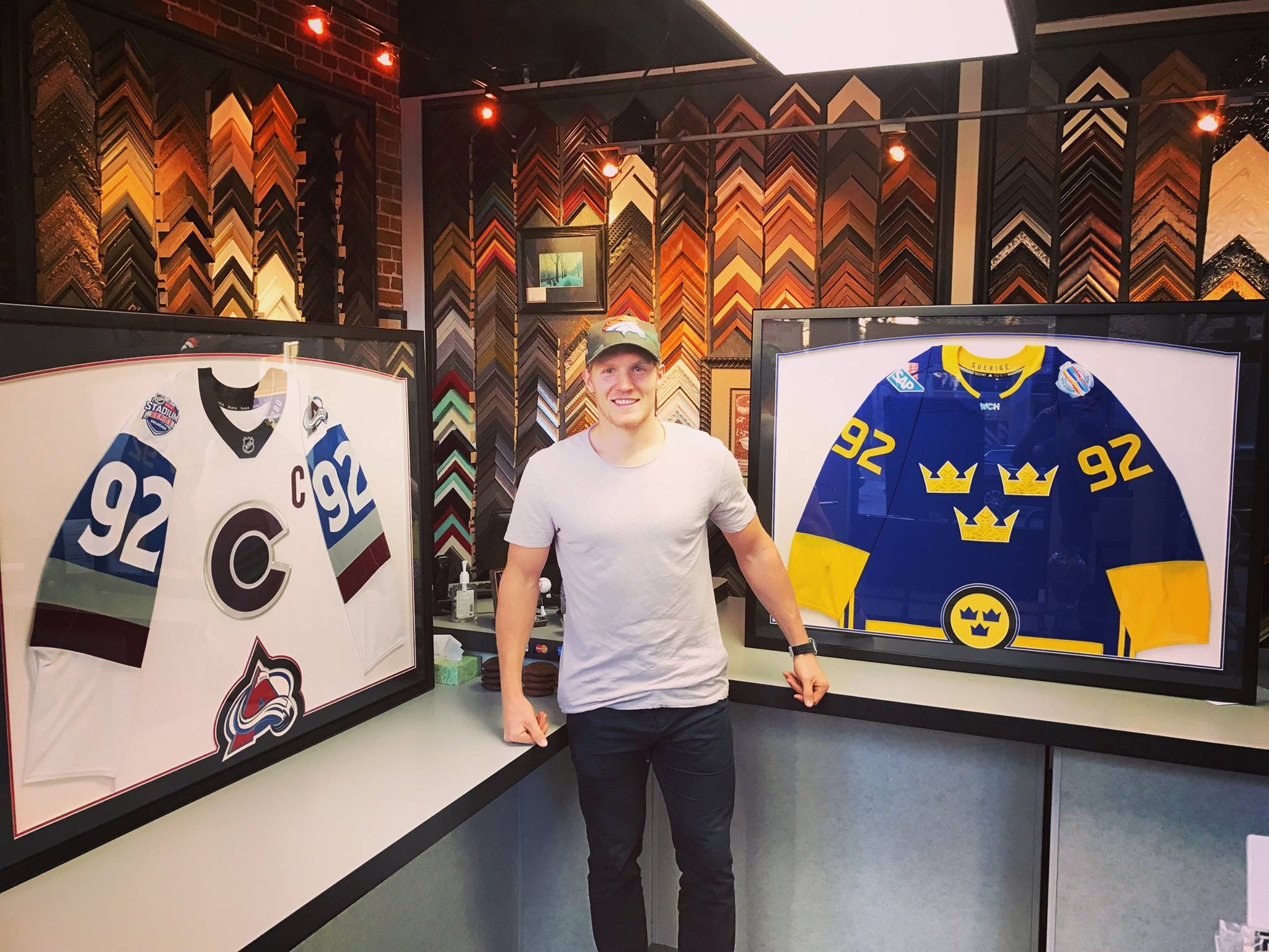 Gabriel Landeskog with his custom framed Colorado Avalanche and Team Sweden hockey jerseys