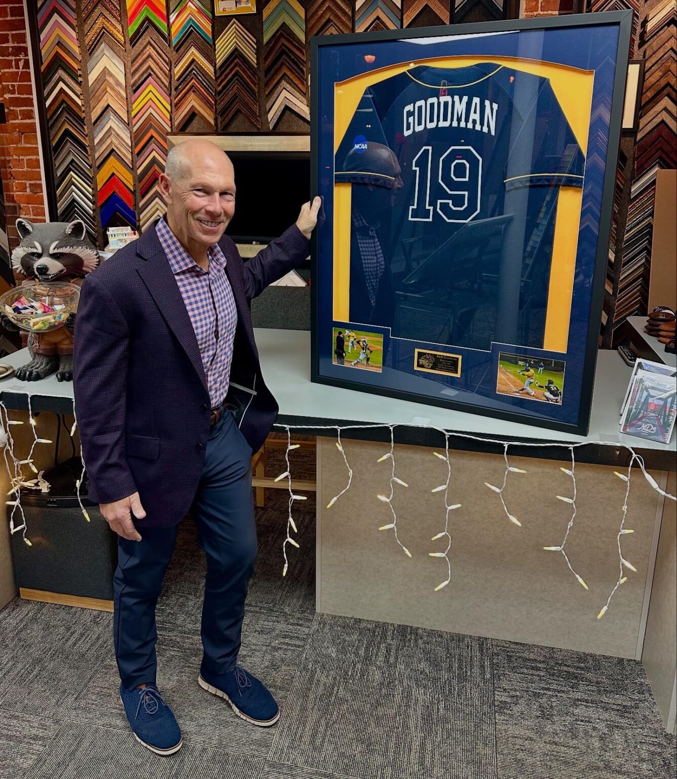 Drew Goodman with his custom framed baseball jersey