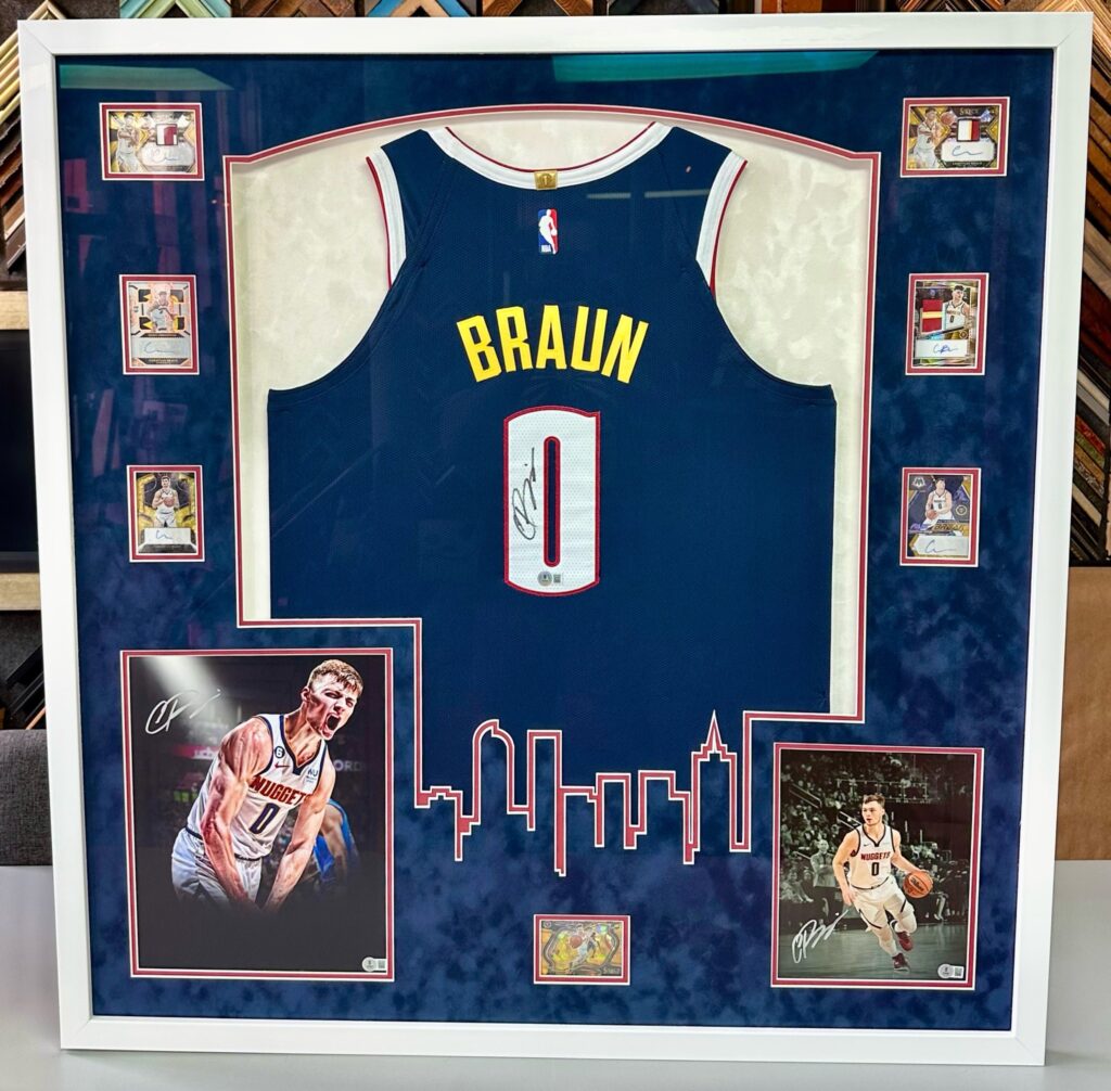 Custom framed Christian Braun signed Denver Nuggets jersey with decorative mat design