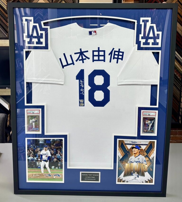 Custom framed Los Angeles Dodgers jersey with baseball cards and player photographs