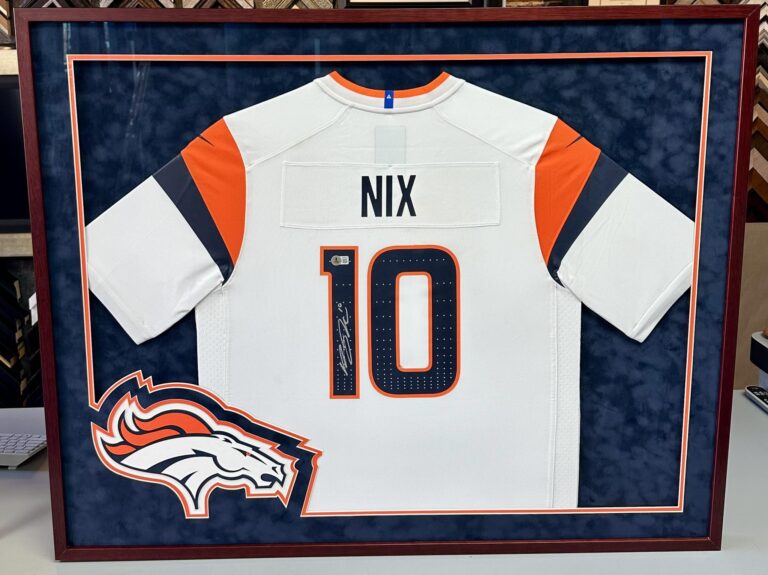 Custom framed Denver Broncos Bo Nix jersey with team logo and sports memorabilia design