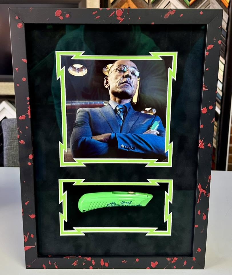 Custom memorabilia shadowbox featuring signed collectible display and framed artwork
